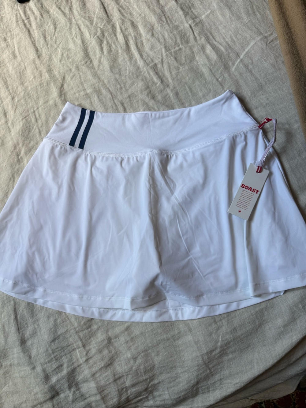 Boast Women's White Tennis Skort with Navy Stripe Detail